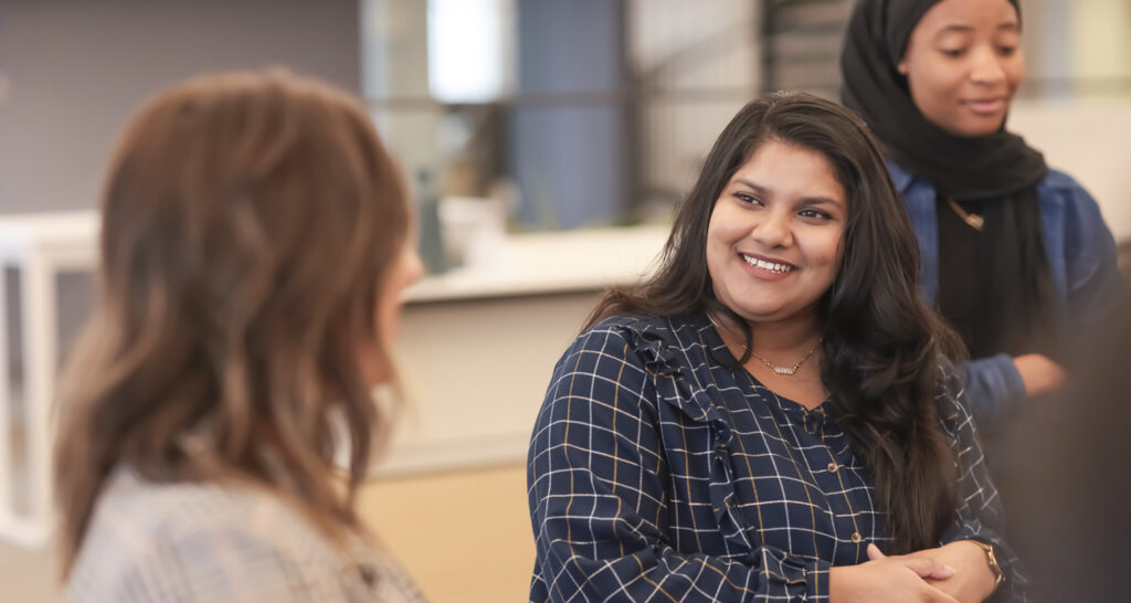 Zeekra Baset Nadi smiles as she talks with fellow BWBR interns