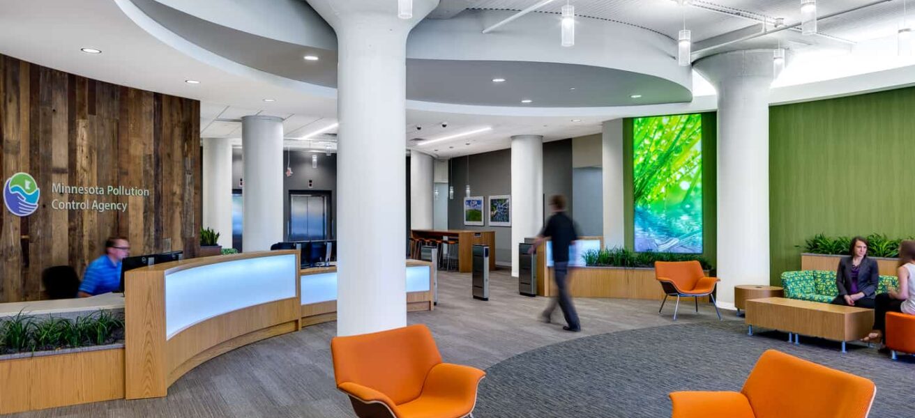 People walk through the nature-inspired, colorful MPCA reception lobby.