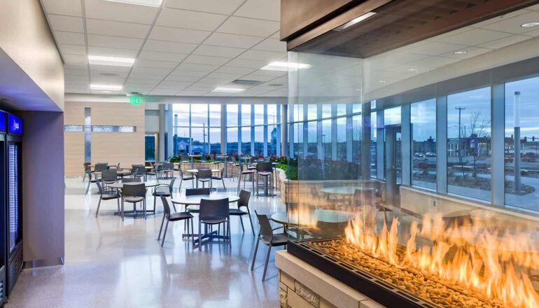 Lobby seating and vending area, featuring a fireplace.