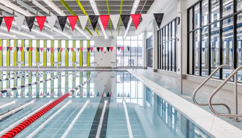 An open lap pool lets in natural daylight, as well as views to the adjacent leisure pool.