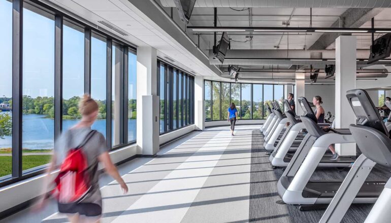 The walking track is surrounded by large windows that overlook the local community.