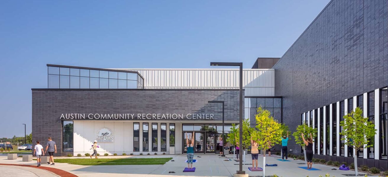 YMCA's front entry where patrons can participate in outdoor activities like group yoga.