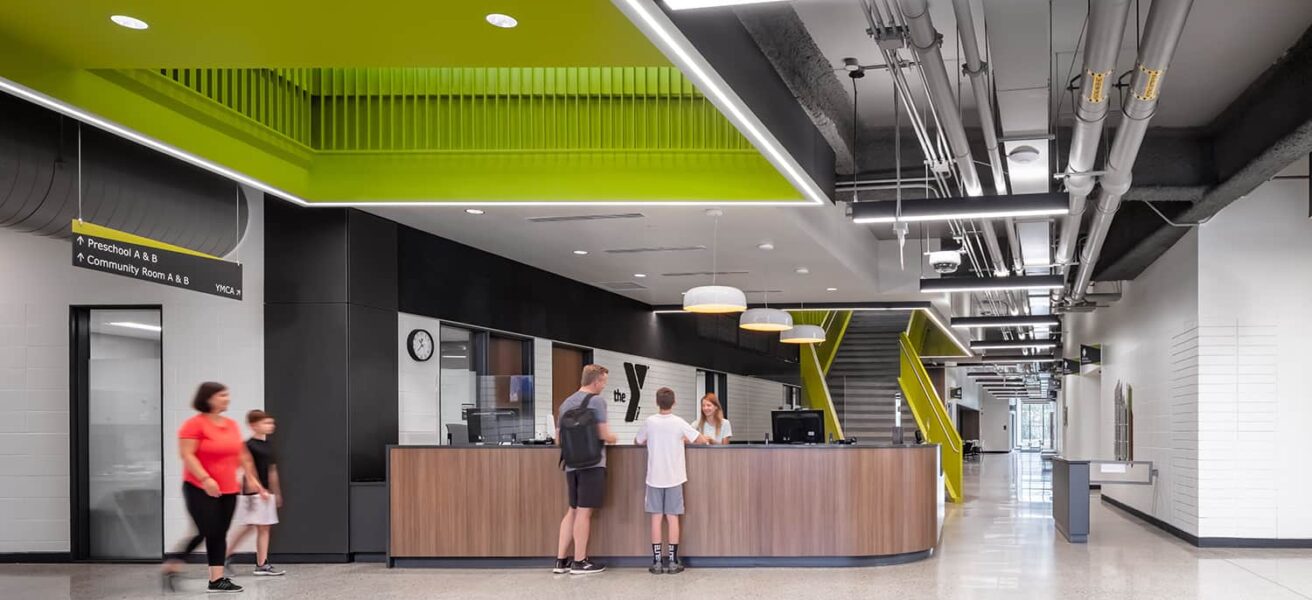 Front desk check-in with green feature ceiling.