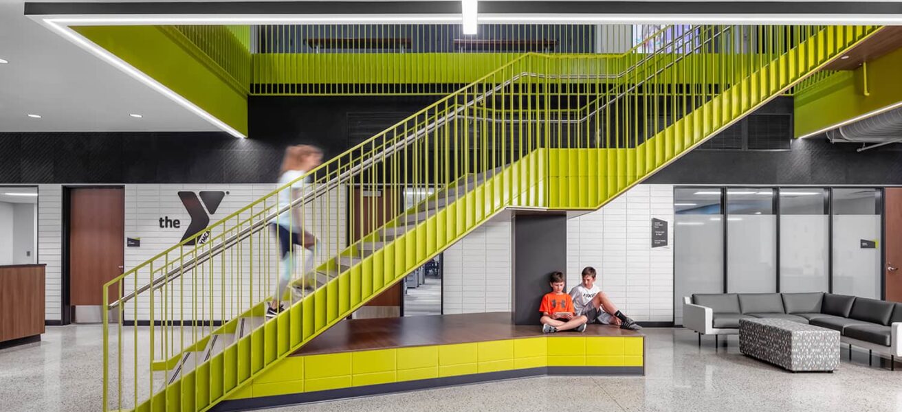 Main green stairwell with seating below.