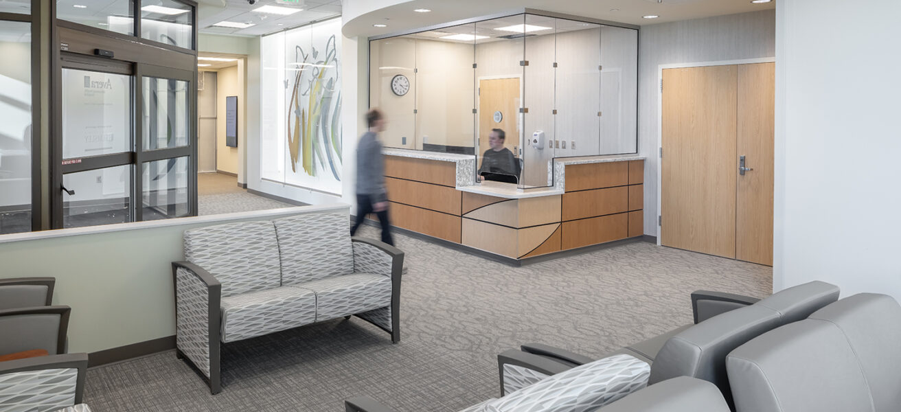 A person talks to the receptionist in the main entry of the Avera Behavioral Health Center