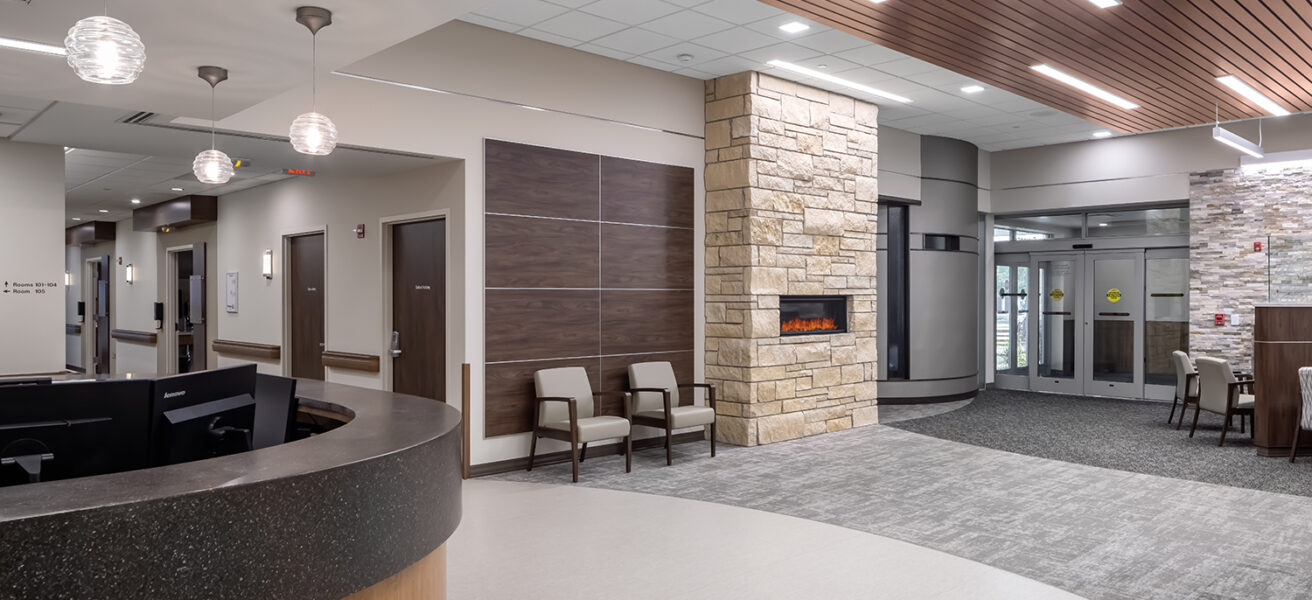 The Avera Missouri River reception and waiting with a fireplace and views to the care corridor.
