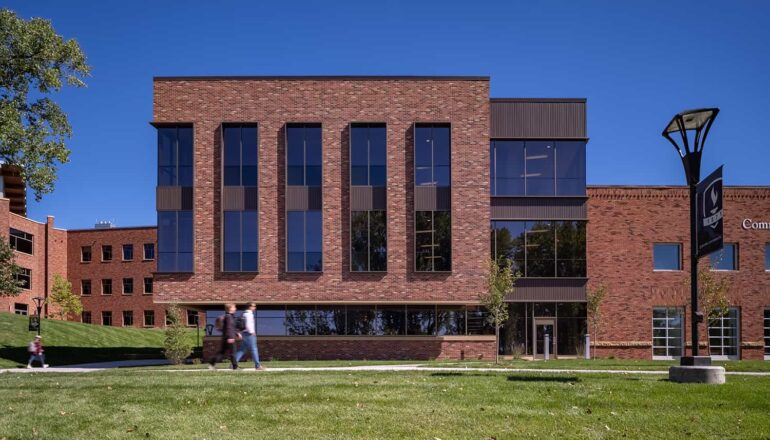 Exterior view highlighting the overall impact of the science facility addition.