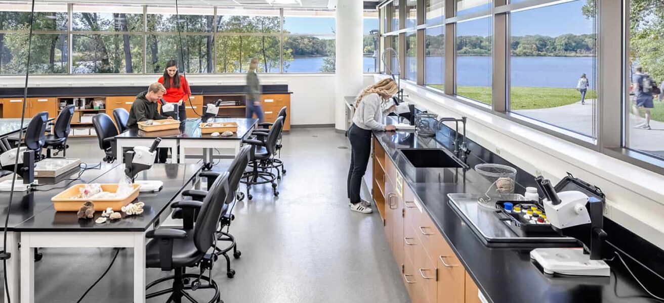 An ecology lab features wrap-around window views and high-tech equipment.
