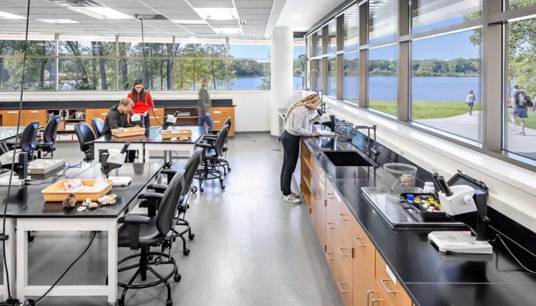 An ecology lab features wrap-around window views and high-tech equipment.