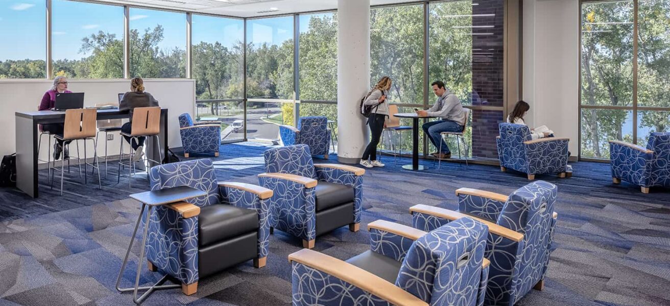 A lakeview lounge offers a quiet place for students to study together, complete with bar-height desk and comfortable armchairs.