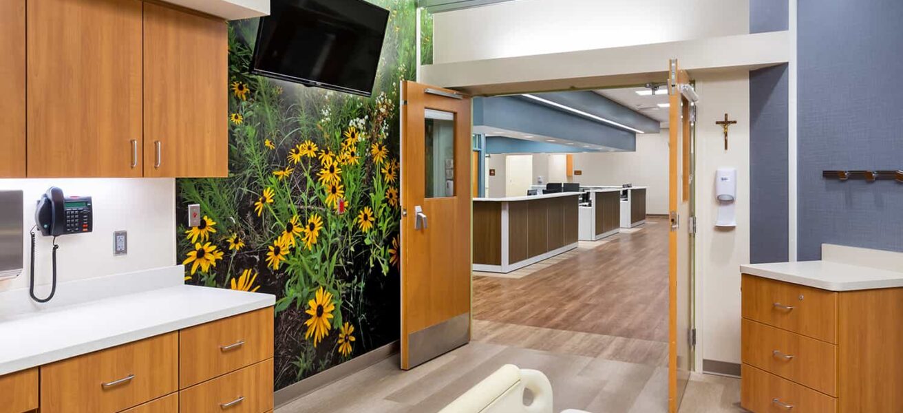 View from a burn unit patient room to the central nurses station.