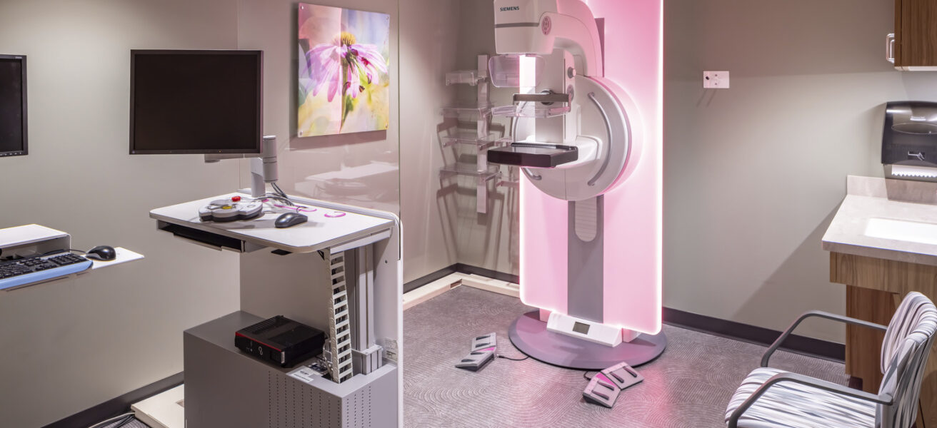 A mammography room with equipment lighting that changes color.