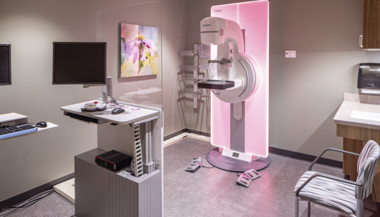 A mammography room with equipment lighting that changes color.