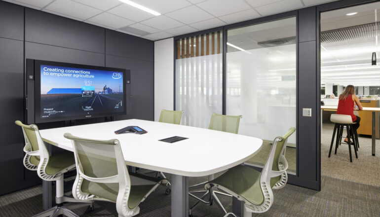 A typical CHS Inc. conference room with views to workstations.