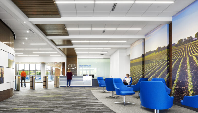 People entering the renovated CHS Inc. secure entry and reception desk.