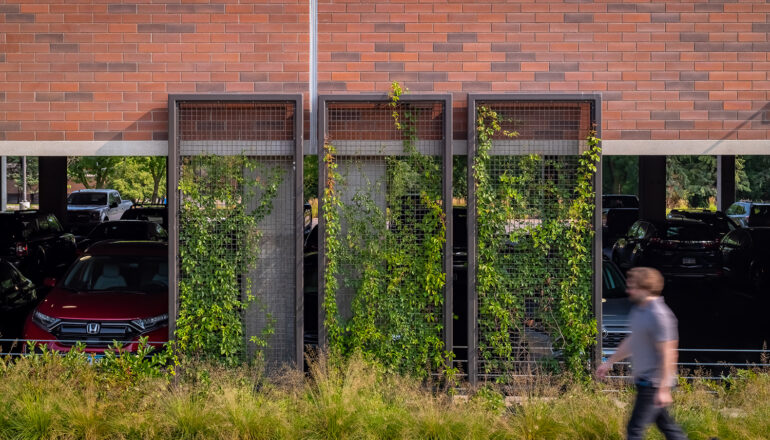 Detail photo of the pedestrian sidewalk with greenery on the CHS parking ramp.