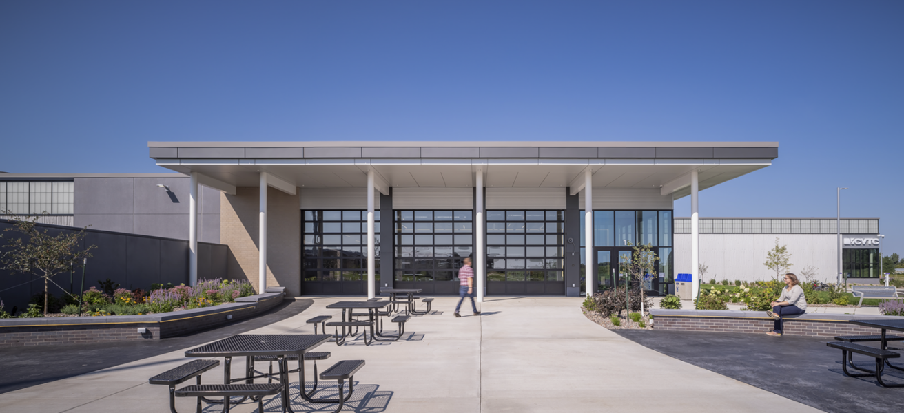 Head on shot of the front patio with outdoor student gathering spaces at the CVTC TEC.