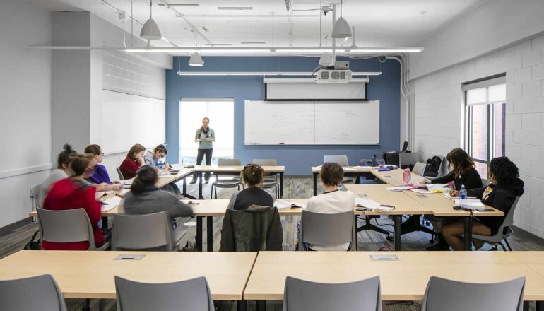 Students attending a lecture in a remodeled classroom.