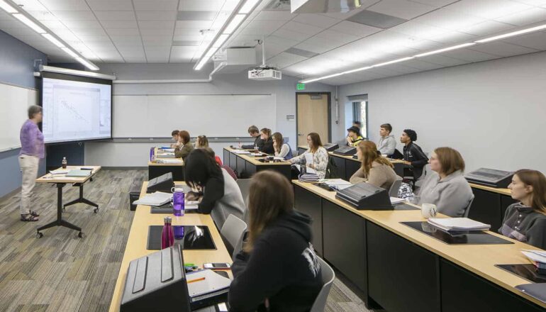 Students attending lecture in a technology-enriched classroom.