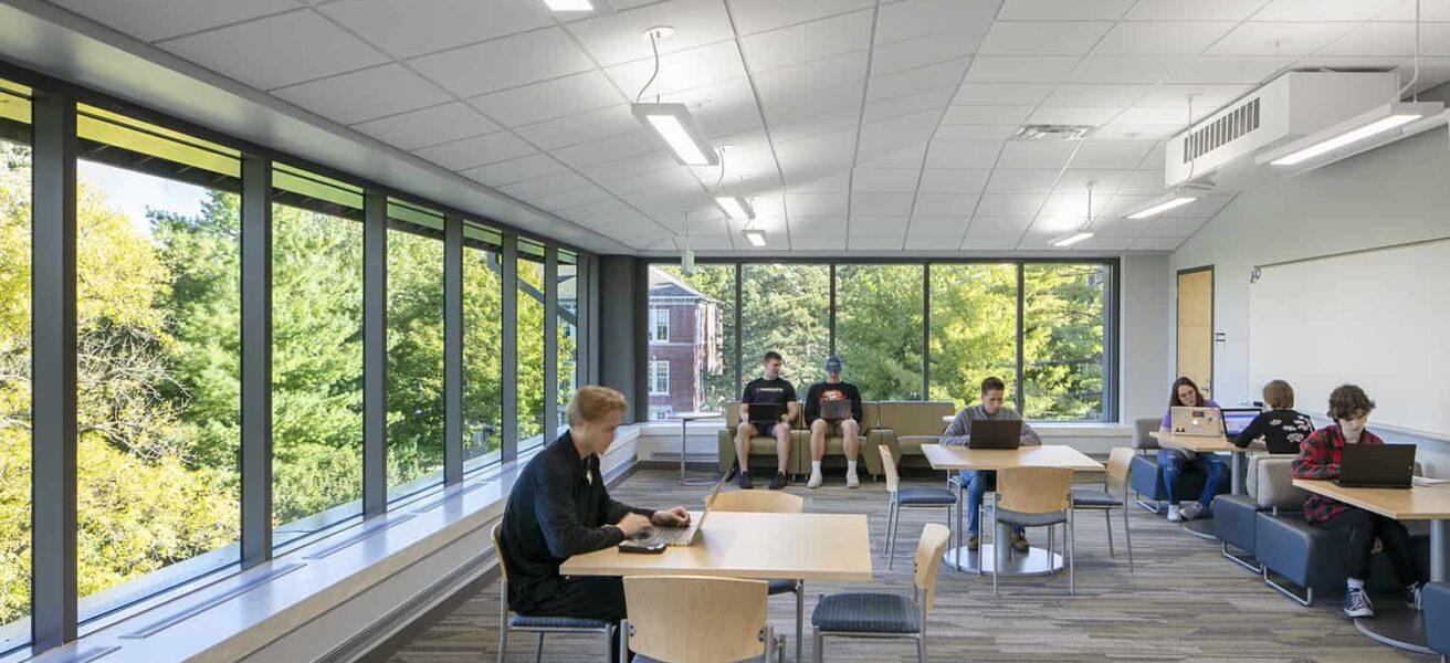 Cornell College students working at various seating options in a study lounge.