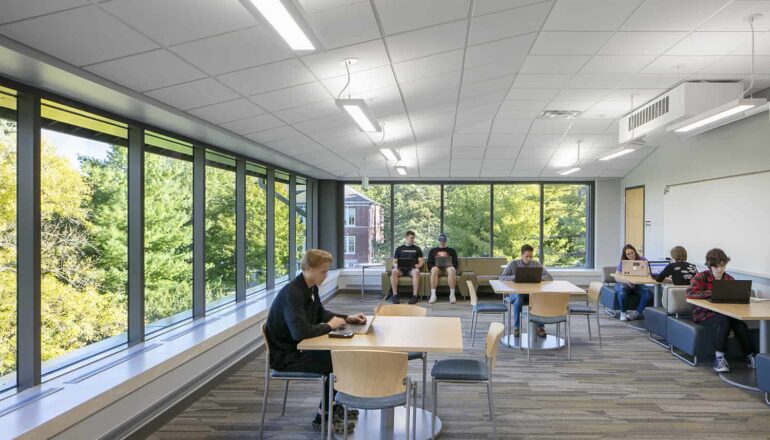 Cornell College students working at various seating options in a study lounge.