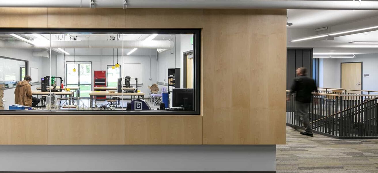 View from corridor into the Engineering maker space through an interior window.