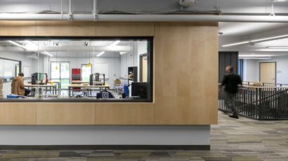 View from corridor into the Engineering maker space through an interior window.