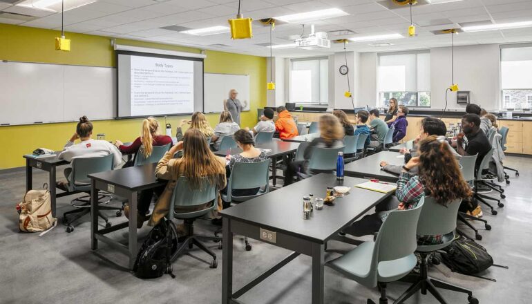 Students seated for a lecture in a biology classroom.