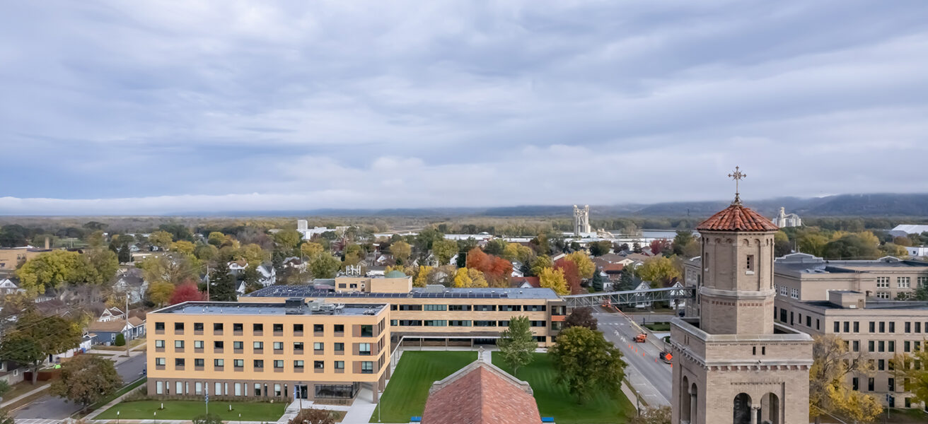 An aerial view of the Cotter Schools campus with a nearby chapel in the foreground