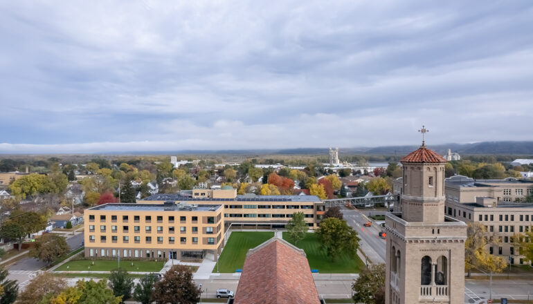 An aerial view of the Cotter Schools campus with a nearby chapel in the foreground