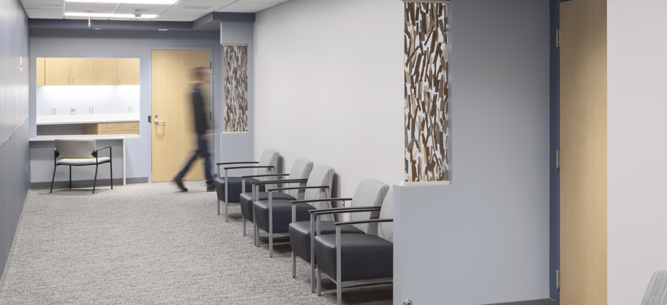 A person walks through a waiting corridor in the Crete Area facility.