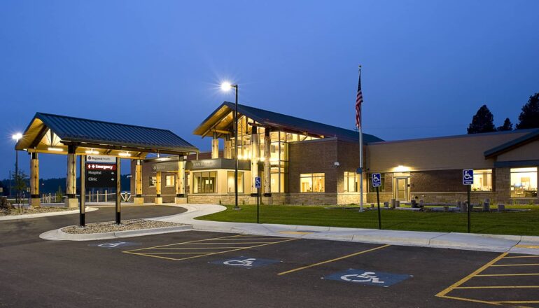 The exterior entry of the Custer Hospital at night time