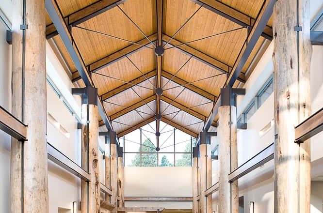 The main lobby of the Custer Hospital is encircled by white pine columns to emulate the Black Hills environment