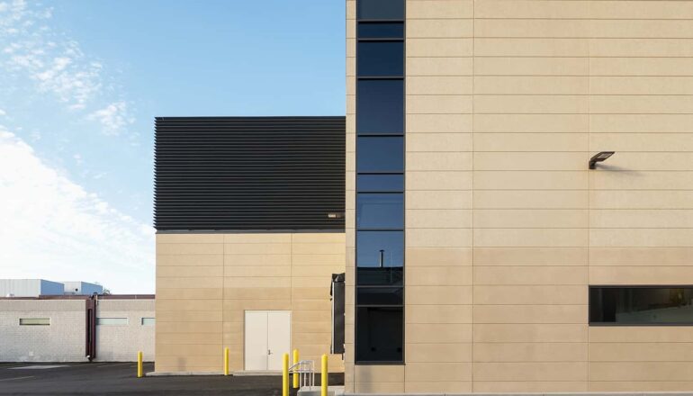 Exterior view of the dry room expansion with privacy glass and stormwater management.