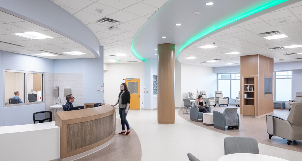 The main gathering space and nurse station in the EmPATH unit, with color changing lights in the ceiling.