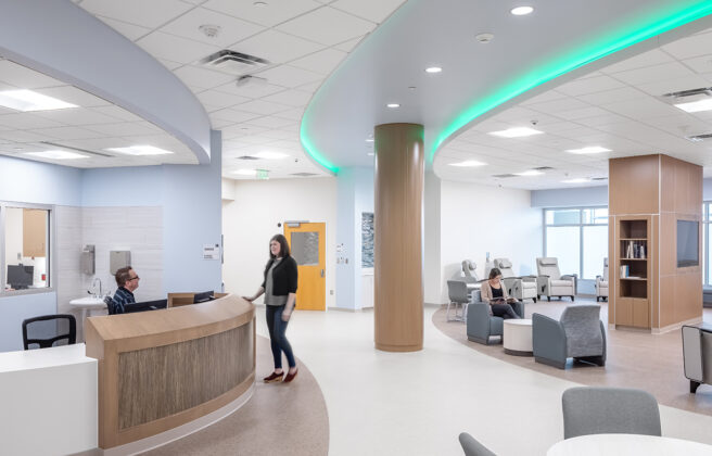 The main gathering space and nurse station in the EmPATH unit, with color changing lights in the ceiling.