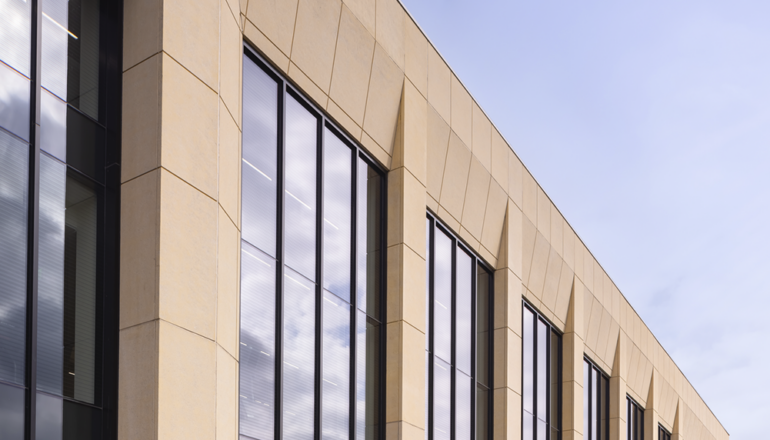 People run past the exterior of the Lund Center