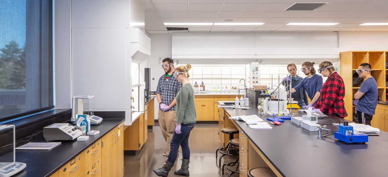 Students working in a lab with large windows.