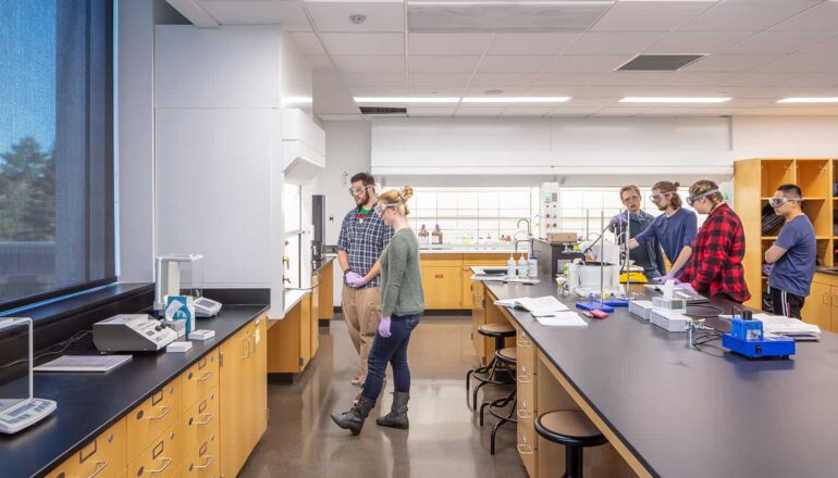 Students working in a lab with large windows.