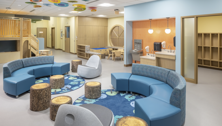 The Redleaf Center's activity room is a balance of adult therapy spaces and children's play spaces. The entire family can receive care in one open area