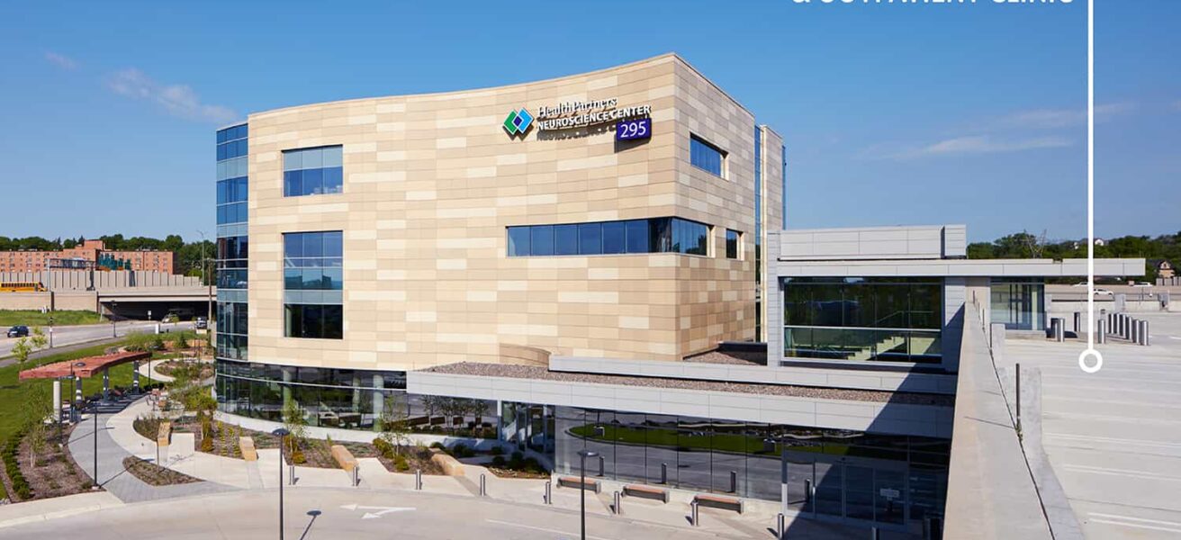 Exterior view of the Neuroscience campus, showing the connection between parking ramp and clinic.