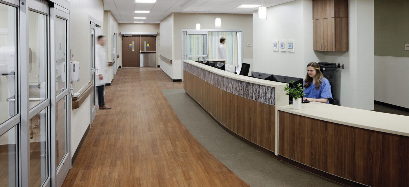 Nursing staff work in the JCRHC emergency nurse station and corridor.