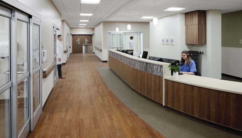 Nursing staff work in the JCRHC emergency nurse station and corridor.