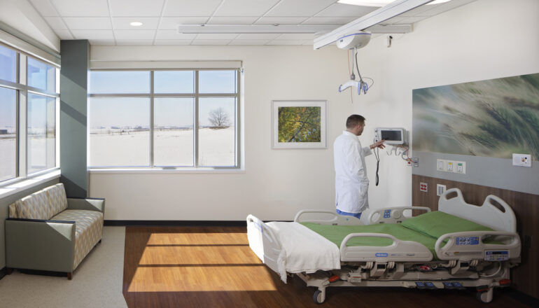 A doctor checks equipment in a hospice room in JCRHC.