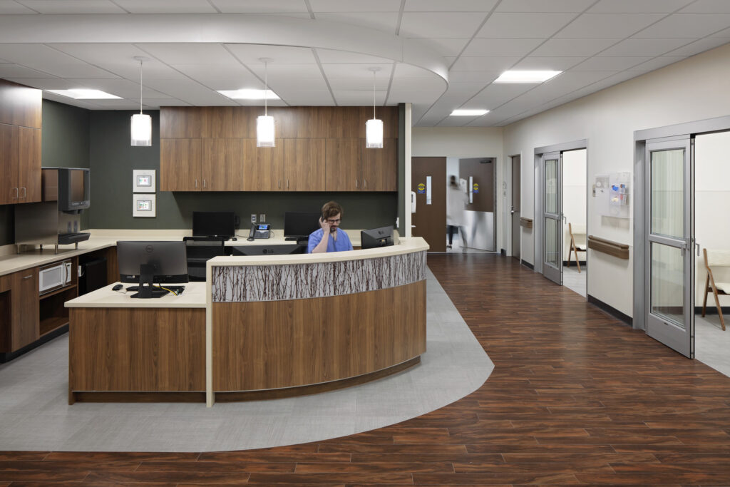 A nurse sits at the nurse station in the surgery department of JCRHC.