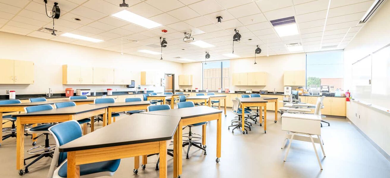 An active learning classroom with flexible seating options and perimeter sink spaces.