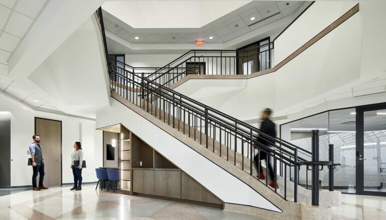 Overall view of the atrium and staircase in the office center.
