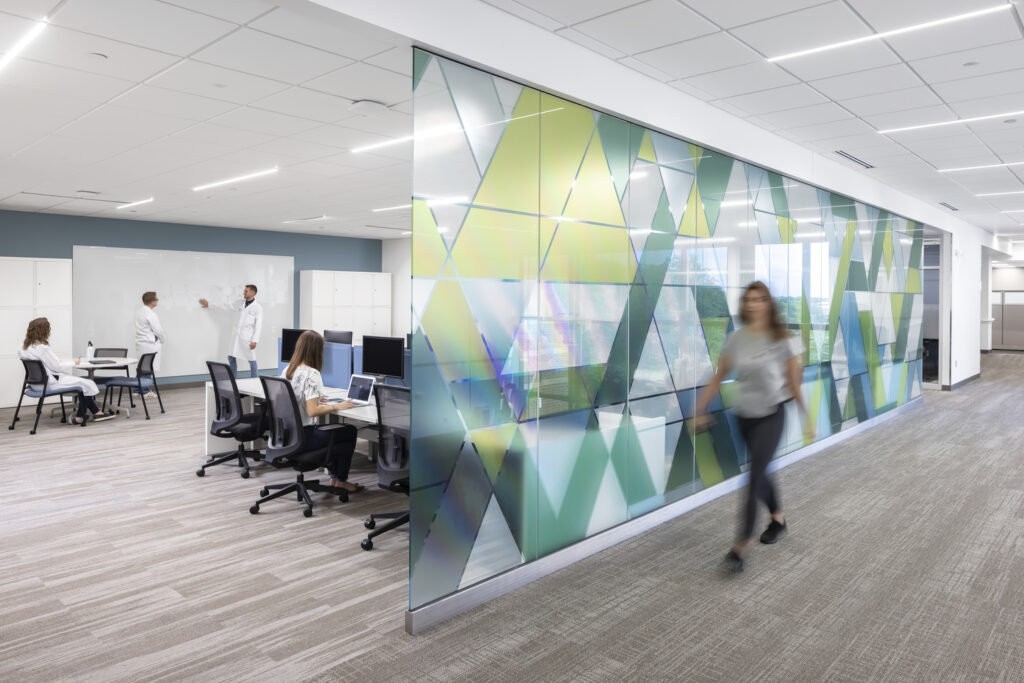 People working in a remodeled collaboration space in the Lifecore offices.