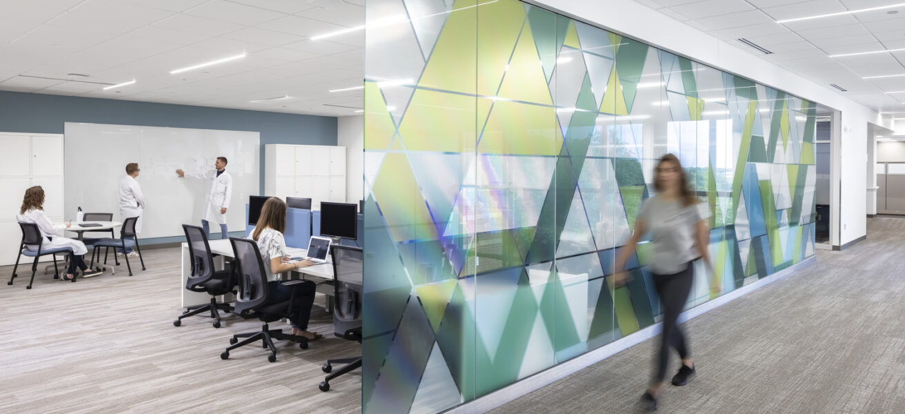 People working in a remodeled collaboration space in the Lifecore offices.