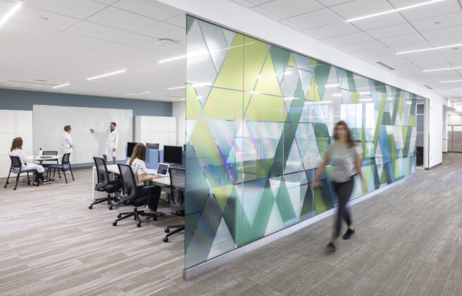 People working in a remodeled collaboration space in the Lifecore offices.